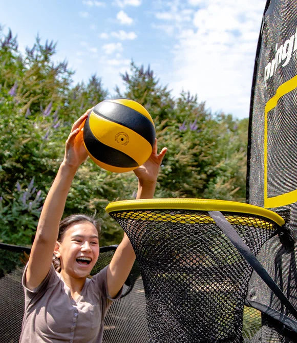 Girl shooting a ball in a hoop