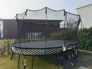 Charger l'image dans la visionneuse de galerie, Oval trampoline in a backyard