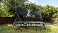 Charger l'image dans la visionneuse de galerie, A girl jumping on a Large Oval Trampoline