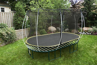 Load image into Gallery viewer, Oval trampoline with a safety enclosure net in a grassy area.